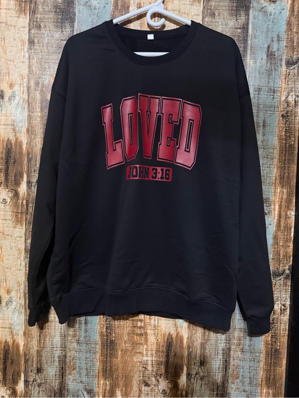Black Crewneck Sweatshirt with Red "LOVED" Graphic